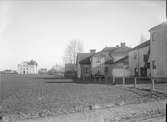 Tegnérgatan - Börjegatan, Luthagen, Uppsala år 1908. I bakgrunden Luthagsskolan i kvarteret Sverker