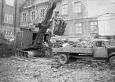 Uppsala stadsbibliotek och Centralbadets simhall under uppförande, kvarteret Torget, Östra Ågatan, Uppsala mars 1940