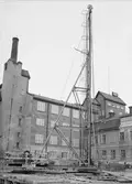 Uppsala stadsbibliotek och Centralbadets simhall under byggnation, Östra Ågatan, Uppsala april 1940