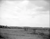 Landskapsvy med Gryta kyrka vid Lårstaviken, Gryta socken, Uppland 1927