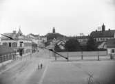 Enköping, Kyrkogatan från torget mot nordost, omkring 1900