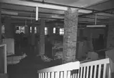 Sal med kvarlämnade saker och tegelpelare i August Werners fabriker i Lindome. Hösten 1994.