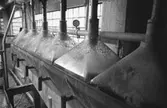 Interiördetalj från pappersfabriken, 1980-tal.
Bilden ingår i serie från produktion och interiör på pappersindustrin Papyrus.