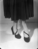 Kvinna med plisserad kjol
Annonskampanj för skor hösten 1948