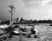 Bostadsområde
Exteriör, blivande centrum. Snötäckt fält i förgrunden