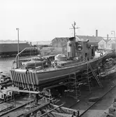 Tullkryssare under byggnad på slipen int o ext