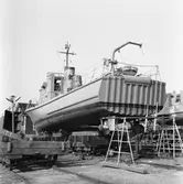 Tullkryssare under byggnad på slipen int o ext