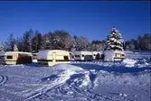 Steneby. Friluftsgården. Vinterbild med husvagnar.