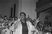 Cyndee Peters sjunger i Lindome kyrka, år 1985.

För mer information om bilden se under tilläggsinformation.