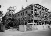 Bostads- och affärshus under byggnation, kvarteret Hjorten, Linnégatan - Svartbäcksgatan, Uppsala 1939