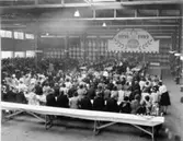 Wargöns AB.

Från 75-års jubileet 1949.
Pappersmagasinet fyllt av inbjudna vid jubileet.