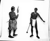 Namibiautställningen: Träfigurer. Herero och Owambo. Målning:  Per Anders Nilsson.  Vänersborgs Museum