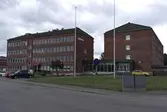 Kontorsbyggnader i rött tegel med fastighetsbeteckning Pottegården 2 och gatuadress Kråketorpsgatan 18 i Åbro industriområde i Mölndal. Fotografi taget den 31 juli 2014. Byggnadsdokumentation inför rivning. Diarienummer: BN 1083/2019.