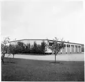 Vägstation G2, Berghem. Garagebyggnad. Postverkets brevlåda på gaveln.