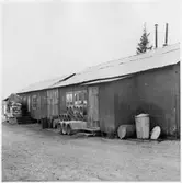 Vägstation BD9, Haparanda. Förrådsbyggnader. Upplag av diverse materiel, bland annat cementrör.