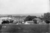 Vy över Borås från Annelund med kommunala Flickskolan till vänster år 1888.