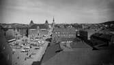 Vy över Stora Torget med torghandel l år 1929.