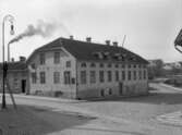 Söderströmska tomten Västerbrogatan Västerlånggatan. kv.Galatea. Stöphus med KFUMs pensionat. Notera lykttändaren på stegen vid lyktstolpen.