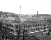 Gummiväveriet fotograferat från Wiskaberg. I bakgrunden syns Annelund och Fänabacken.