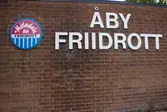 Vägg till friidrottsarenan Åby Friidrott med adress Idrottsvägen 23 i Åby, Mölndal, den 11 oktober 2016. På väggen sitter Mölndas AIK:s klubbmärke uppsatt tillsammans med texten 