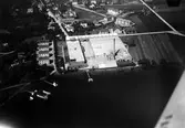Flygfoto av Alingsås Bomullsväveri vid sjön Gärdsken.