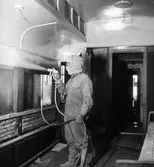 Målningsarbete i järnvägsvagn, 1902-1909