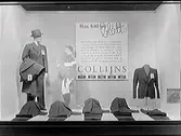Skyltfönster till en herrekipering. Reklamskylten för Collijns (AB Gunnar Collijn, Stockholm) bär rubriken 