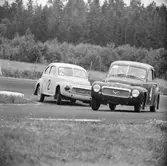 Två Volvo kubbas. Gelleråsen, Karlskoga. 1957-08-26