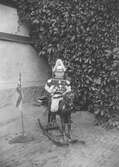 Pojke på gunghäst, ca 1905