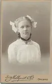 Stina Lindqvist med rosetter, efter 1900