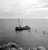 Sandskuta ute vid Solumshamn