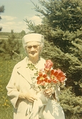 Äldre kvinna med tulpanern ca 1969
