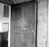 Bagarstuga, dörr mellan kök och förstuga.