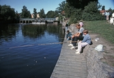 Fiskare sitter och metar, 1992