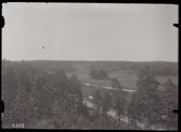 Utsikt från Rocklundaberget, över Vallby friluftsmuseum i Västerås.