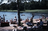 Badgäster på stranden vid Herrfallet, 1995