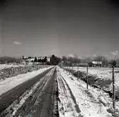 Ekerums gård, utsikt över Solhöjden vårvintern 1957.