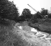 Gripskopa i arbete med kanalrensning, 1980-tal