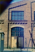 Dörr till Centralverkstäderna, Grev Rosengatan, 1980-1981
