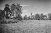 Vy mot Näsby kyrka och prästgård, 1934