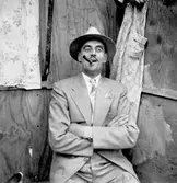 Nöjd man med cigarr, 1950-tal