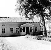 Byggnad i kv. Alströmer 1A, fotat mot söder och Drottninggatan.