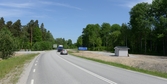 Vägskylt och biltrafik på Glanshammarsvägen vid Hjortstorp, 2016-06-02