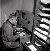 Nilssons foto, Erik Nilsson i arbete.