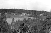 Yxtabacken med gårdar och skog, 1930-tal