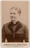 Porträtt på Gustava Håkansson, Tvättföreståndarinna på lasarettet i Jönköping år 1880-talet, senare gift med tunnbindare Nilsson.