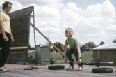 Tyngdlyftare konsentrerar sig, 1970-tal