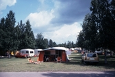 Husvagnar och tält på Gustavsviks camping, 1980-tal