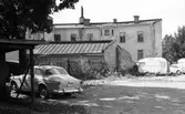Bil parkerad på rivningstomt på Ekersgatan, 1974