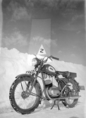 Motorcykel vid snövall